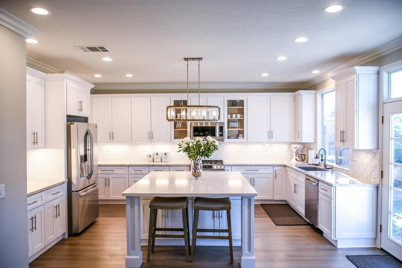 a kitchen with white cabinets