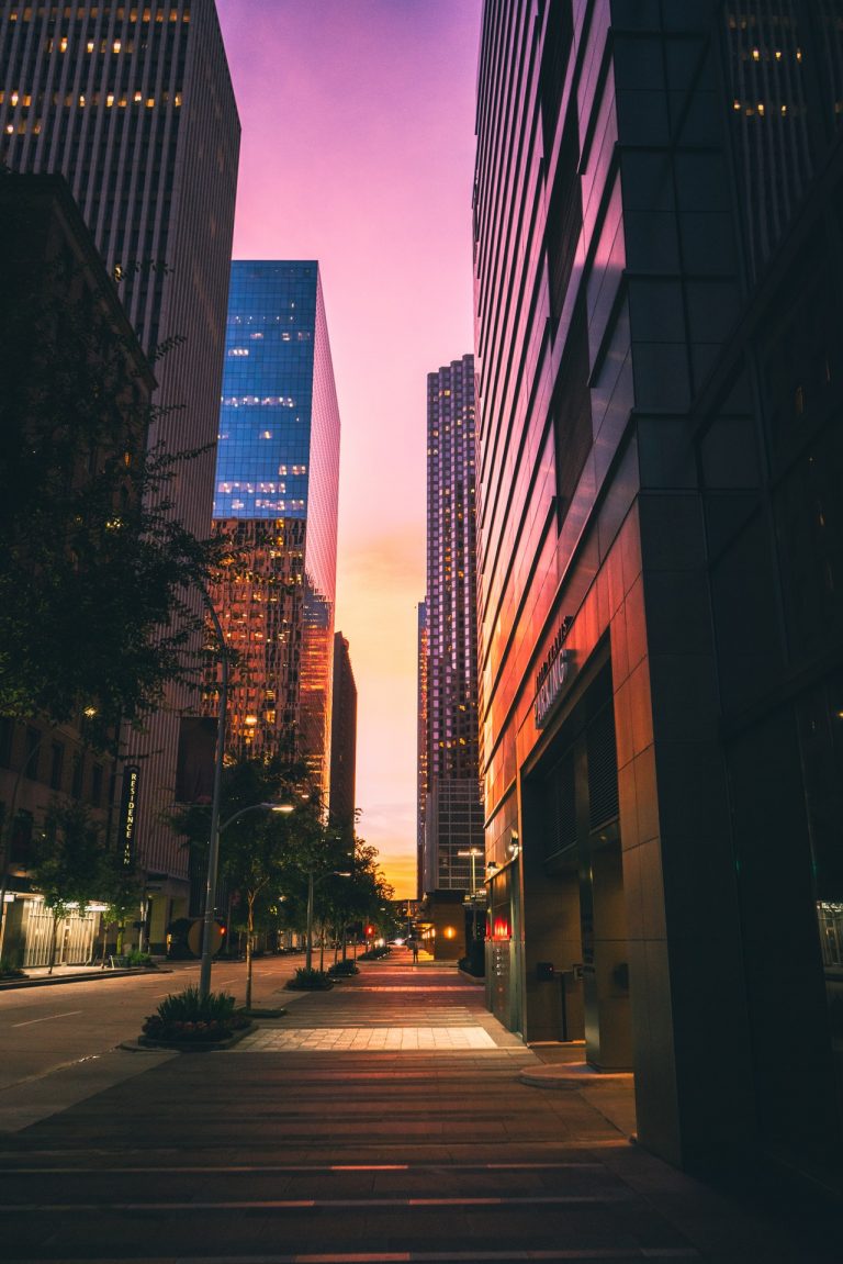 a city street with tall buildings