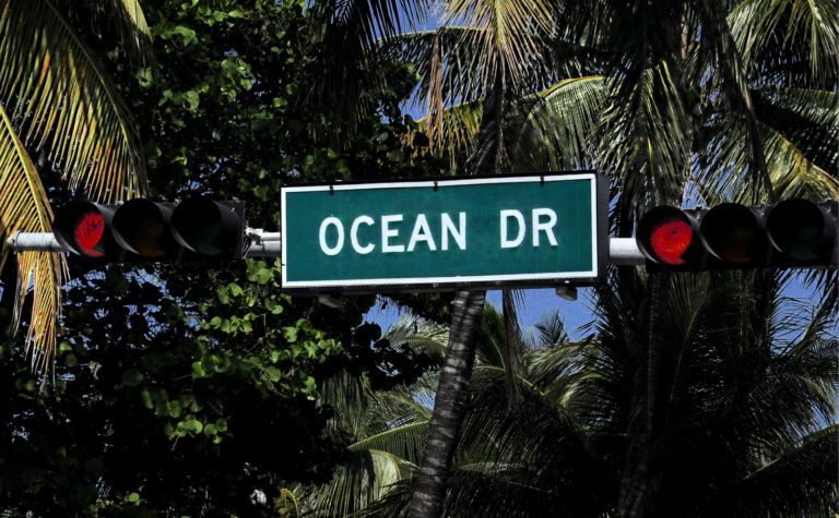 a street sign is posted on a pole