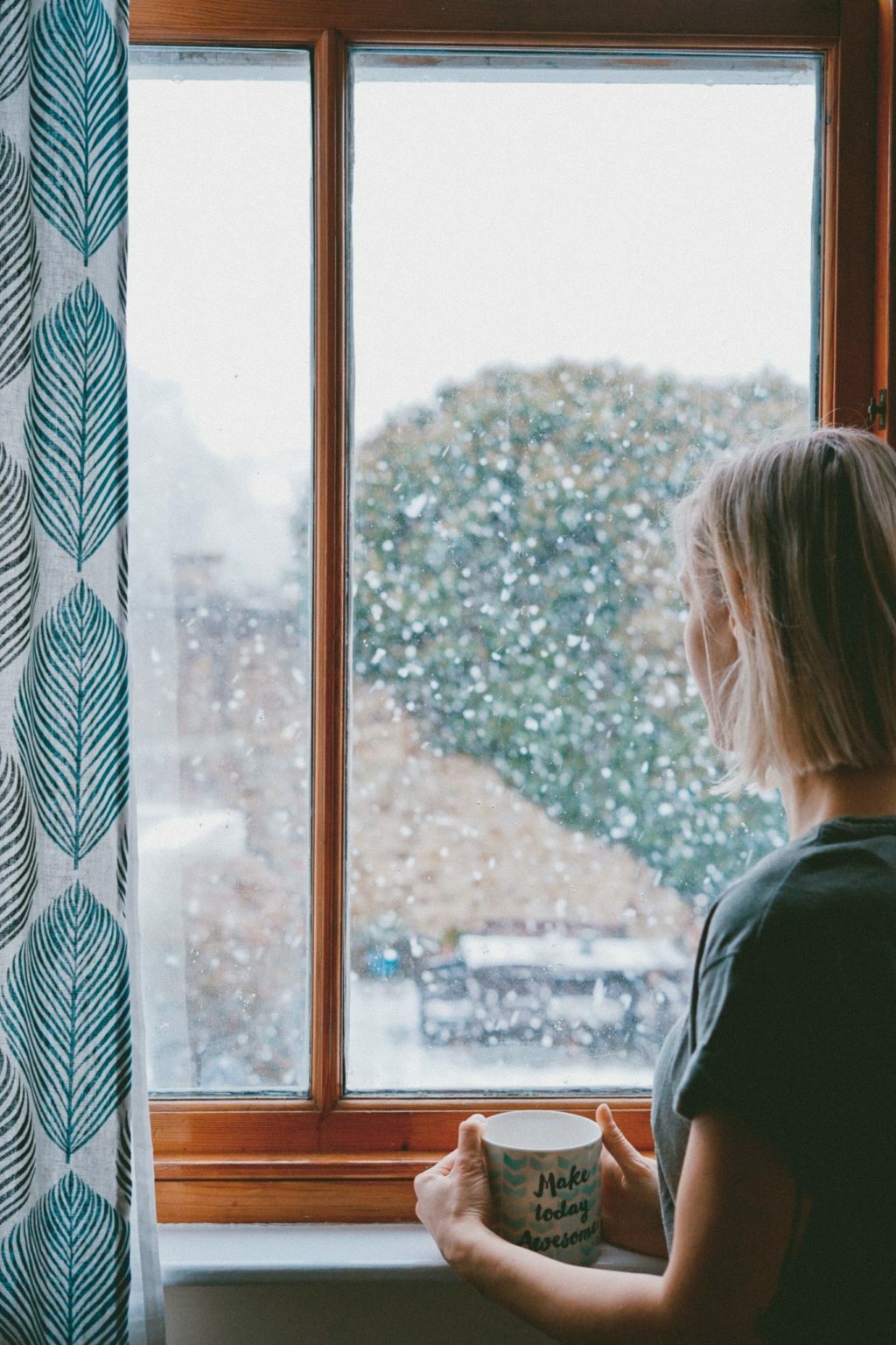 a woman looking out a window