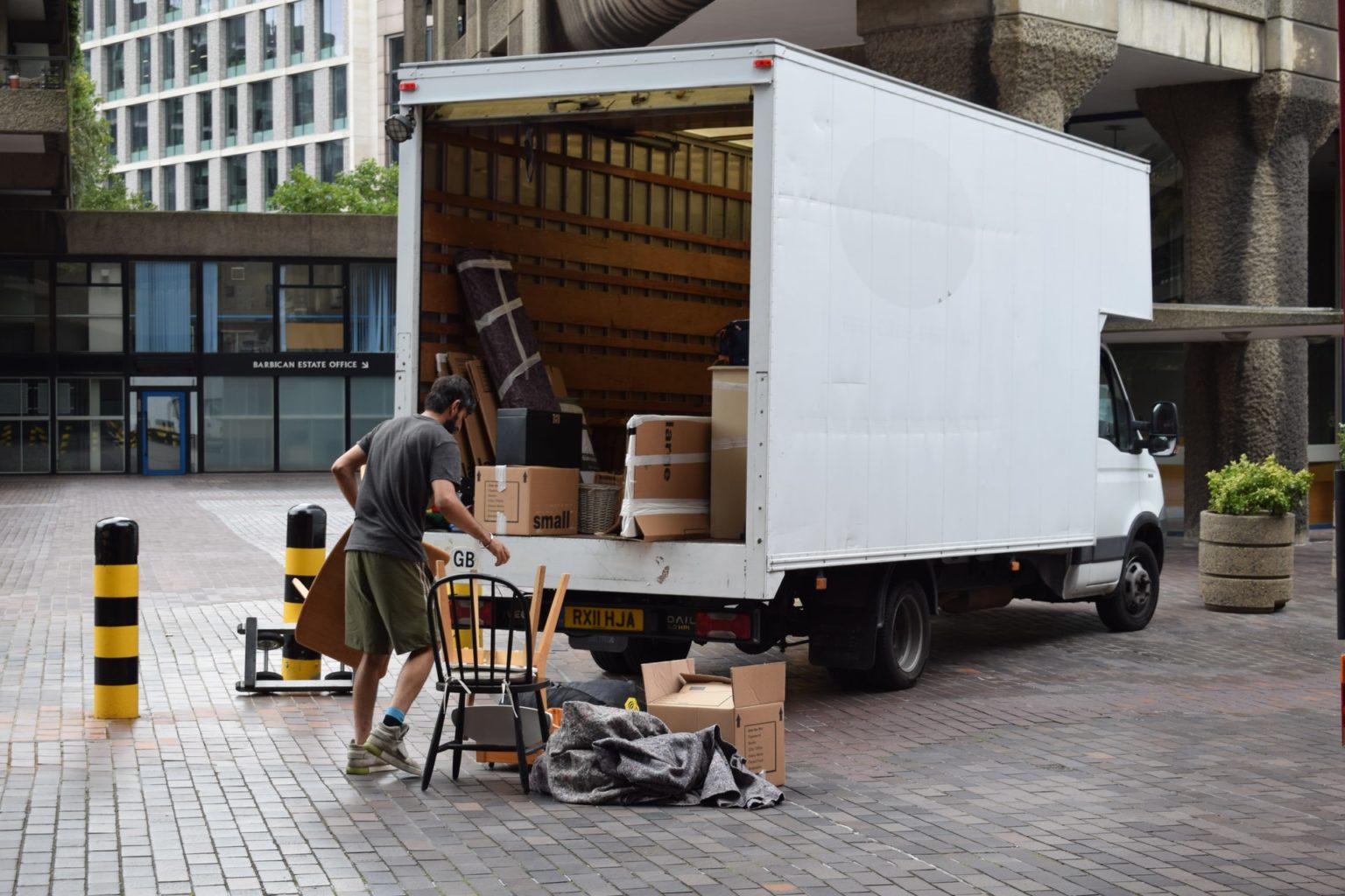 a person loading a large white truck