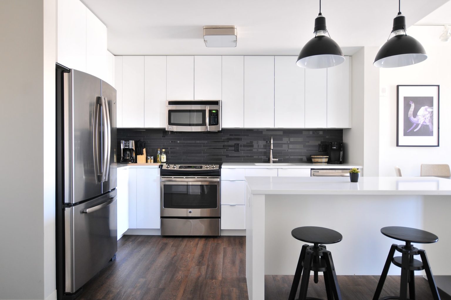 a kitchen with white cabinets