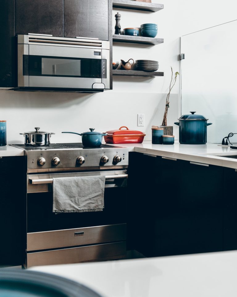 a kitchen with a microwave oven and a stove