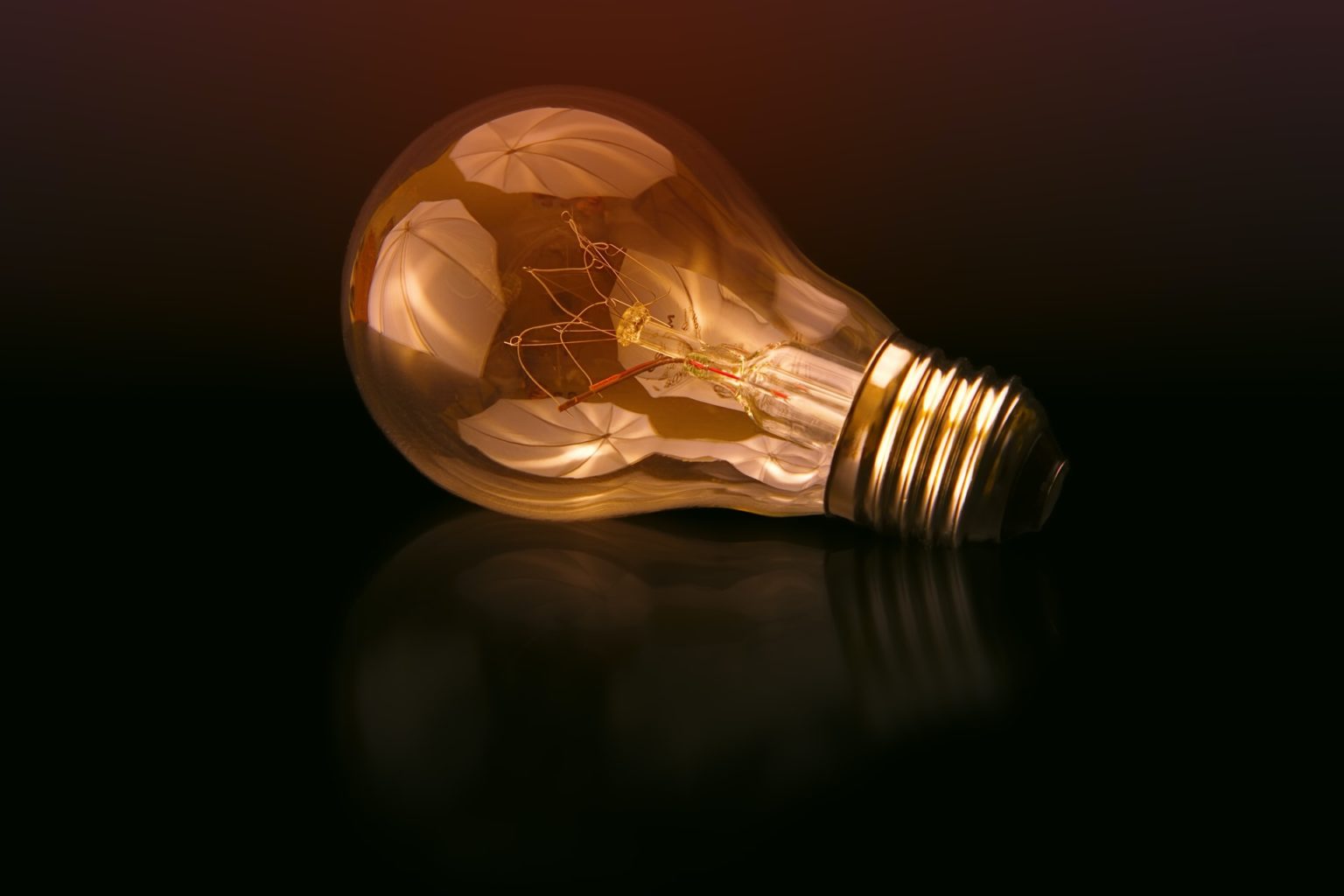 a light bulb with a flame