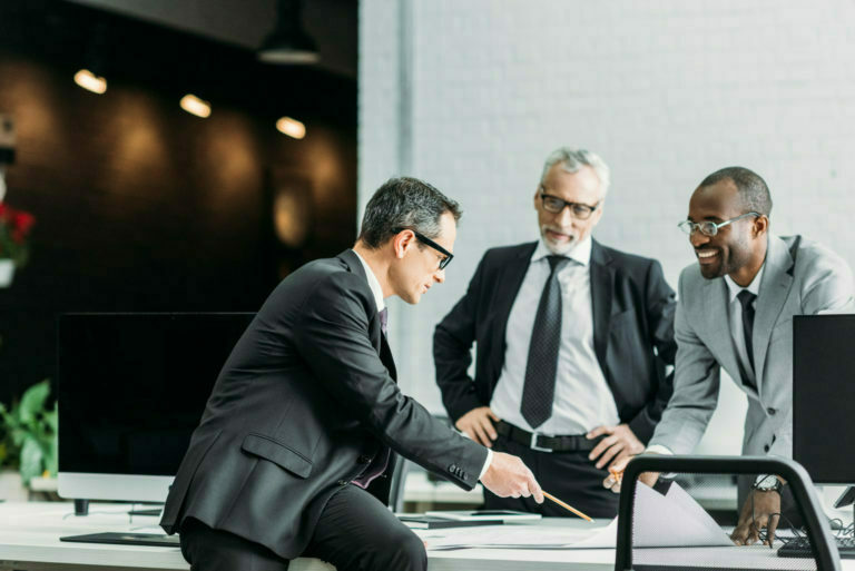 multiethnic businessmen discussing new business strategy on meeting in office